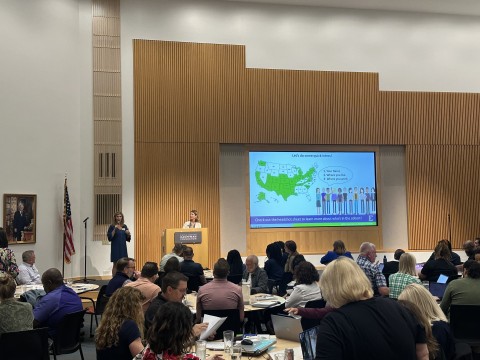 Torree speaking at education finance event