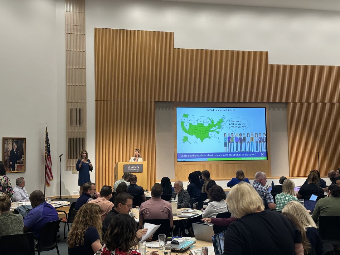 Torree speaking at education finance event